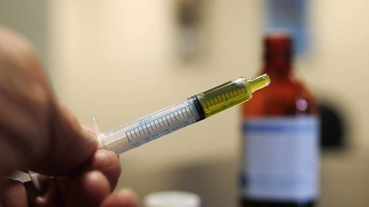 In this Monday, Nov. 6, 2017, photo, a syringe loaded with a dose of CBD oil is shown in a research laboratory at Colorado State University in Fort Collins, Colo.