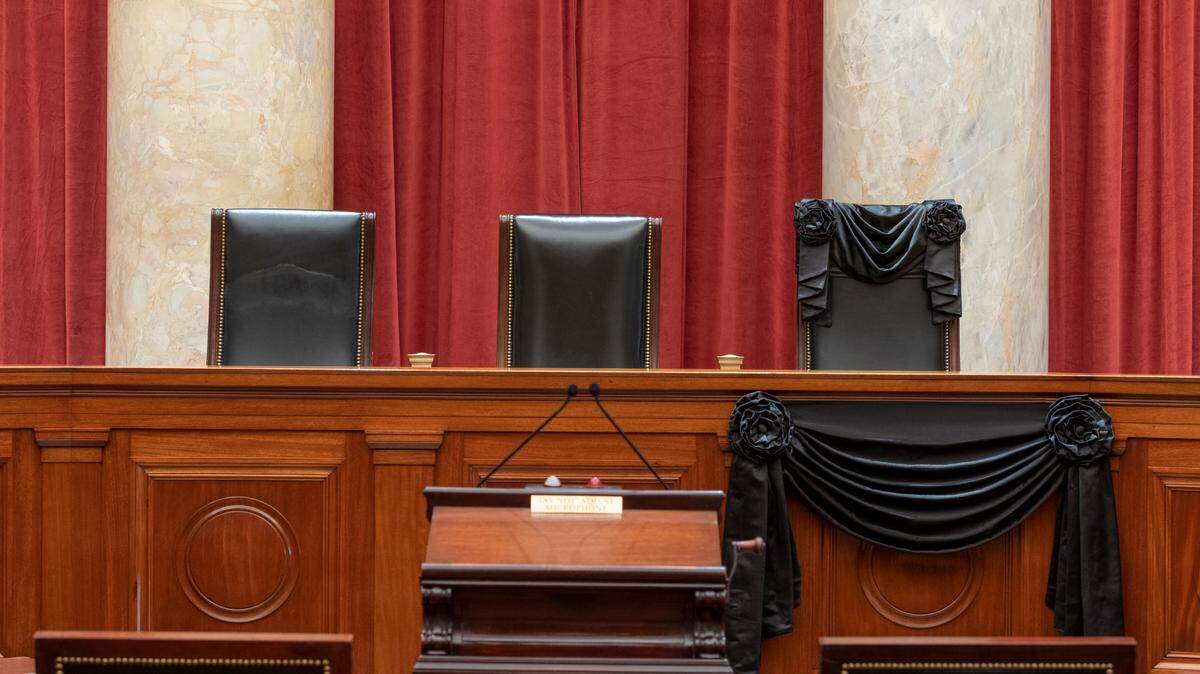 This Sept. 19, 2020, photo provided by the Supreme Court, shows the Bench draped for the death of Supreme Court Associate Justice Ruth Bader Ginsburg at the Supreme Court in Washington.