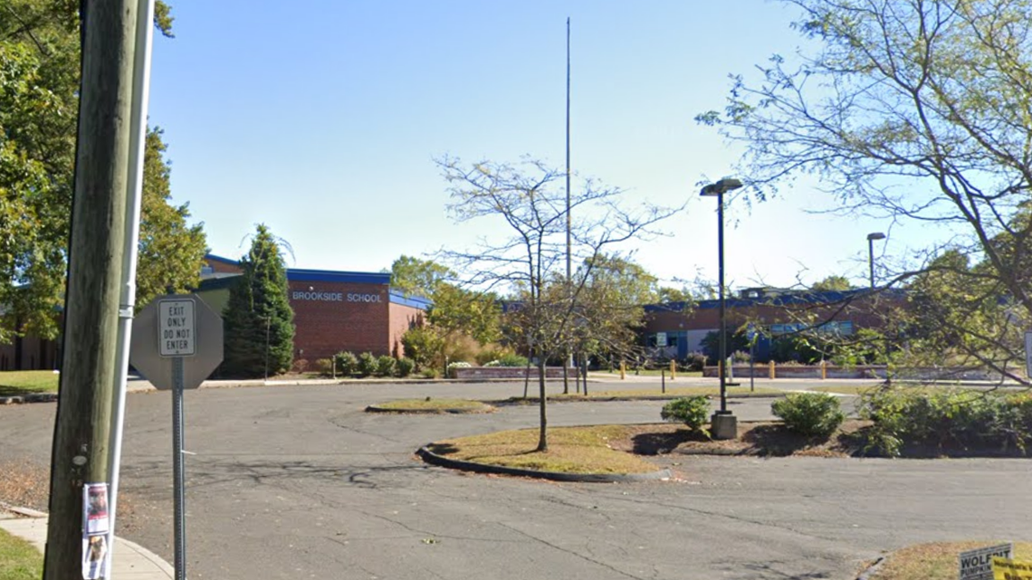 An employee at an elementary school in Norwalk, Connecticut, was arrested after a student lost consciousness during a chokehold demonstration, police said.