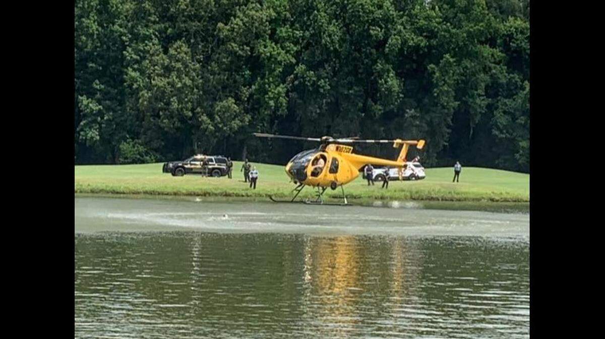 Authorities tried to scare away alligators in a pond after a man jumped in while trying to escape police, Georgia cops said.