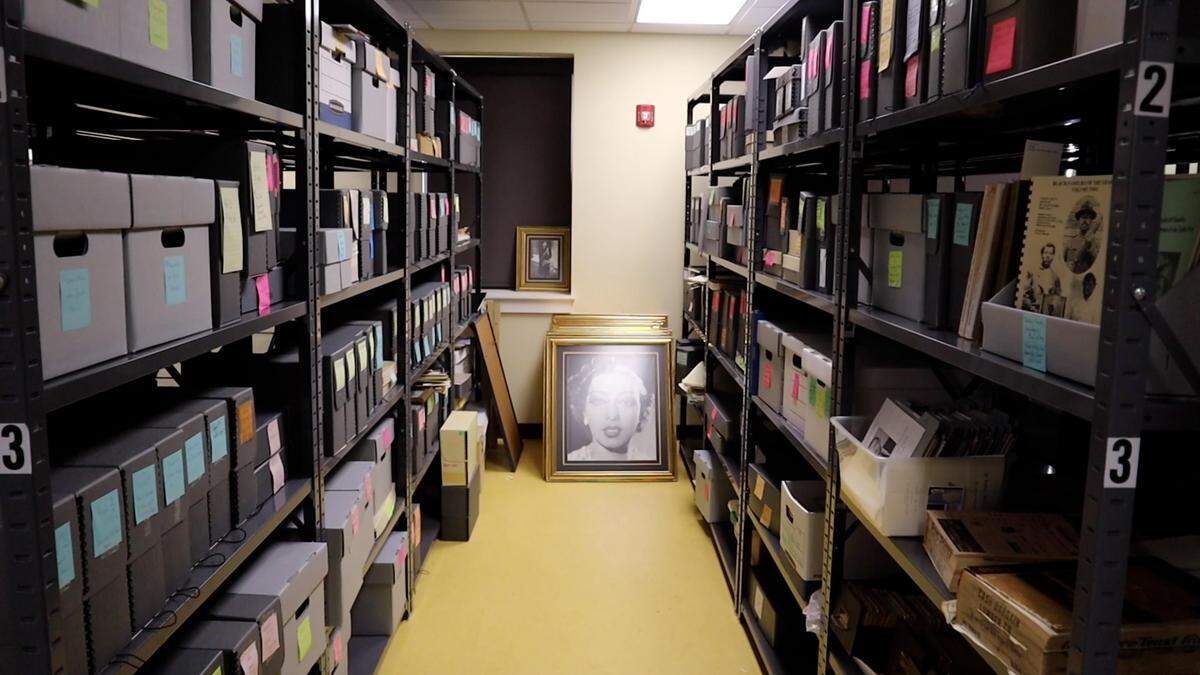 Two rows of cataloged boxes holding documents and other records, upstairs in The Black Archives of Mid-America. 