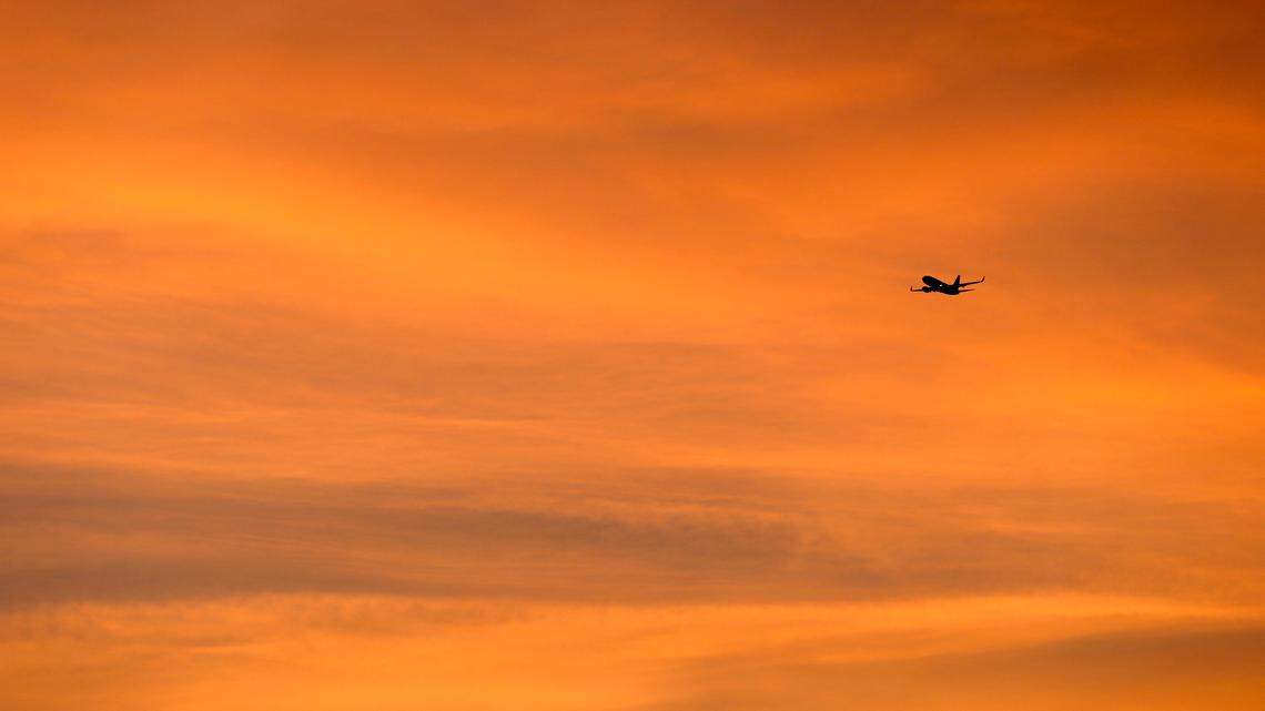 A plane crosses the evening sky at sunset as it prepares to land Wednesday, Aug. 20, 2014, in Houston. (AP Photo/David J. Phillip) A morning flight headed to Colorado was diverted to Wichita, Kansas after a passenger refused to wear a mask, used profanity and demanded alcohol, airport police said.
