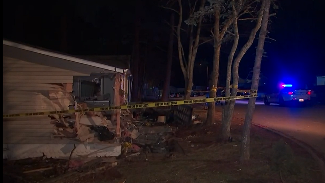 The driver was killed and three people inside the house were injured when a car crashed into a Georgia home, police said.