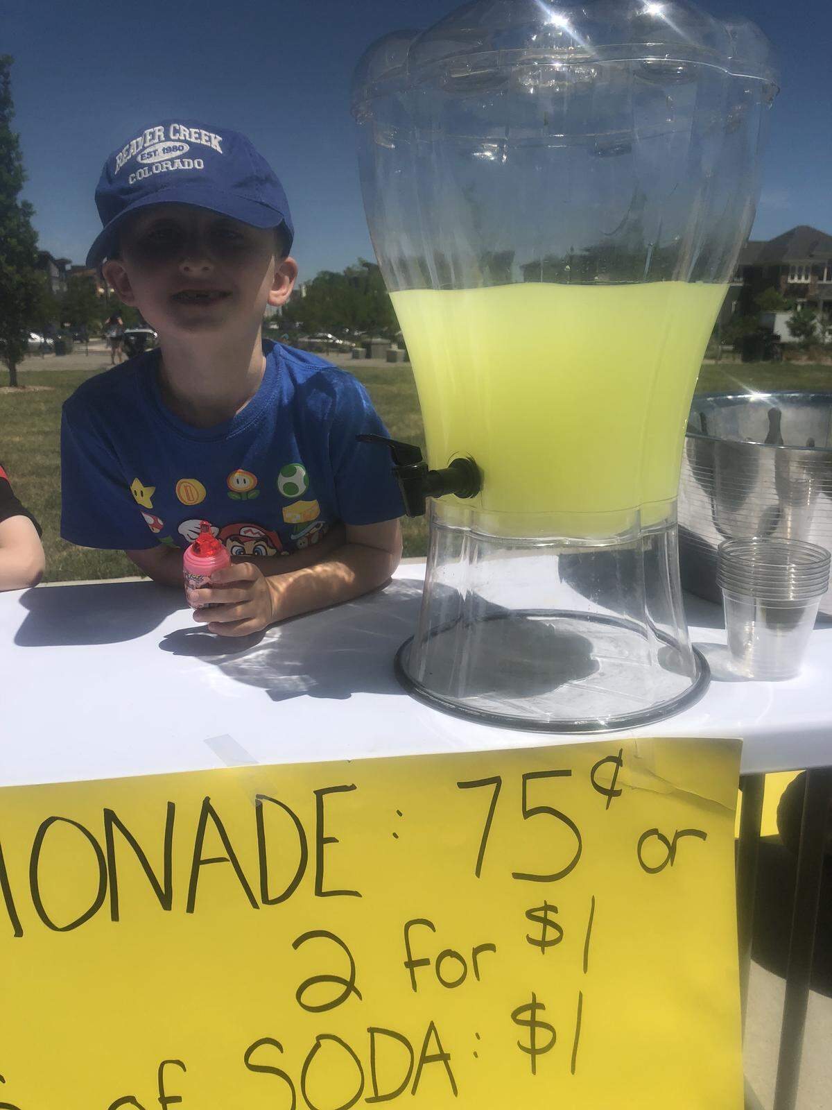 Jennifer Knowles and her three sons were selling lemonade for Compassion International, a Colorado Springs-based charity.
