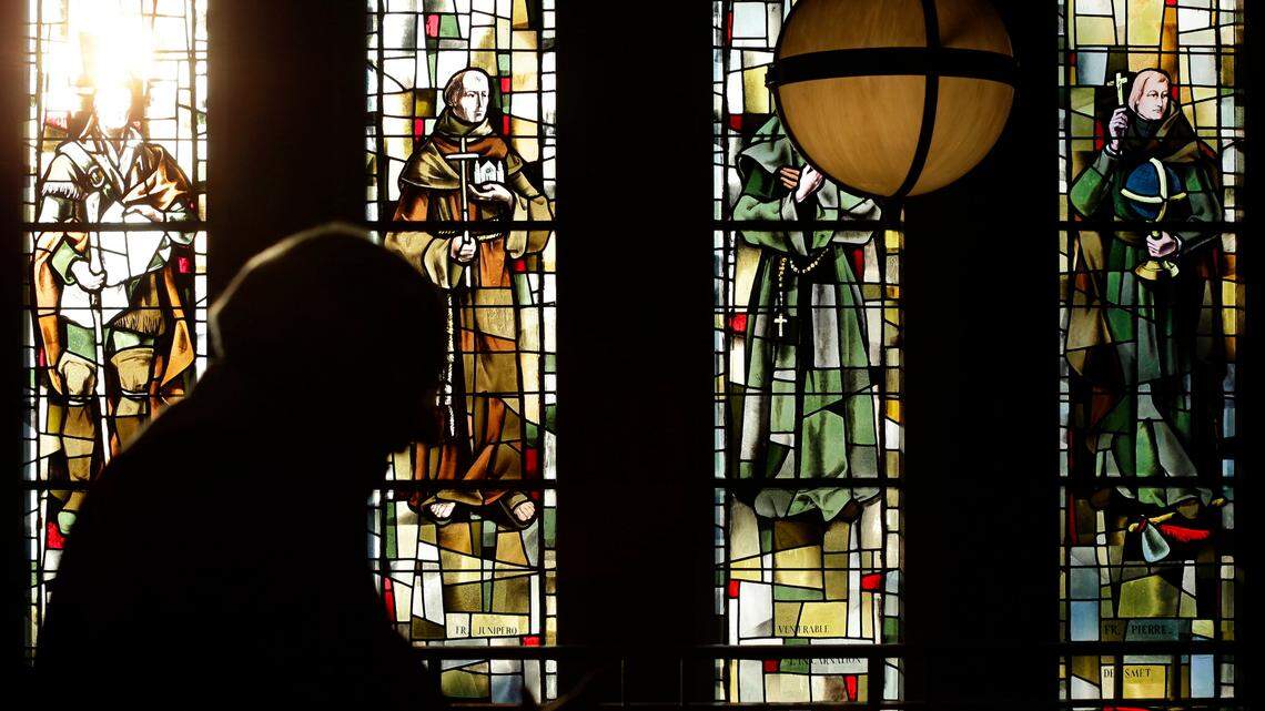 A deacon walks past stained glass windows after a mass at Cathedral of Mary Our Queen in Baltimore on March 13, 2012. A motion filed by the Maryland Attorney General on Thursday, Nov. 17, stated that there were over 600 victims of child sexual abuse committed by the clergy in the state over the past 80 years.