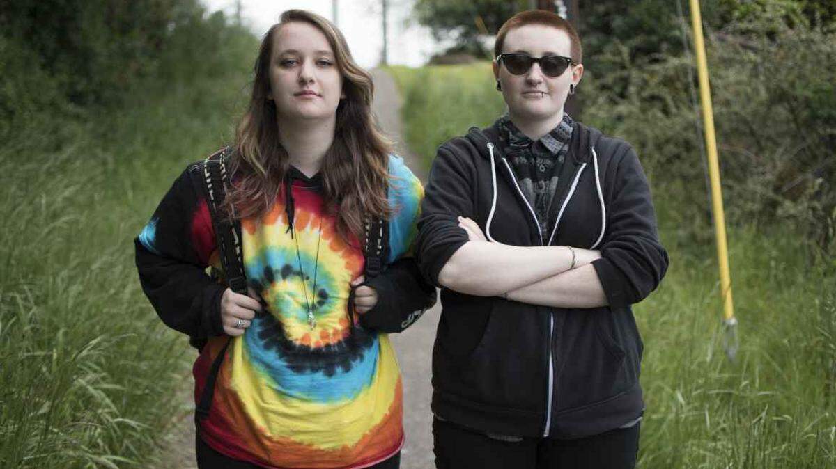 Liv Funk, left, and Hailey Smith first complained to the State of Oregon about the climate of discrimination they faced as gay students in 2016.