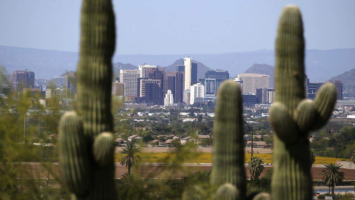 Framed by saguaro cactus, the downtown Phoenix skyline is easier to see as fewer motorists in Arizona are driving, following the state stay-at-home order due to the coronavirus, and it appears to be improving the air quality and decreasing the effects vehicle emissions have on the environment.