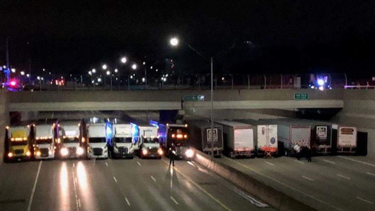 Michigan police say they helped prevent a suicidal man from jumping off an overpass and onto a Detroit freeway early Tuesday morning by blocking traffic and then getting 13 trucks to park underneath the bridge.