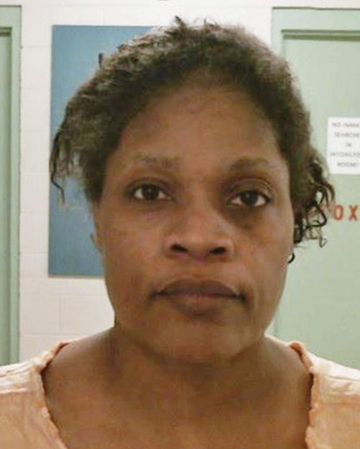 Carolyn Jones, 48, has been charged with first-degree murder after her 20-month-old granddaughter, Royalty Marie Floyd, was found stabbed and burned inside an oven. Authorities have confirmed that the child was living at the residence with Jones at the time of the murder.