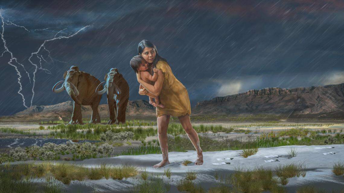 In a scene from the ice age, a woman holding a child on the shores of the ancient Lake Otero leave the footprints in the mud.