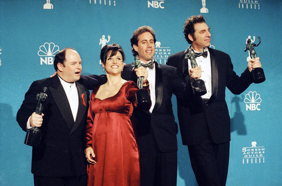 FILE - In this Feb. 22, 1997 file photo, “Seinfeld” cast members, from left, Jason Alexander, Julia Louis-Dreyfus, Jerry Seinfeld and Michael Richards pose together backstage after they won Outstanding Performance by an Ensemble in a Comedy Series at the Screen Actors Guild Awards, in Los Angeles. Online network Hulu on Wednesday, April 29, 2015 announced it has landed exclusive subscription on-demand rights to “Seinfeld” and future AMC series. (AP Photo/Chris Pizzello, File)