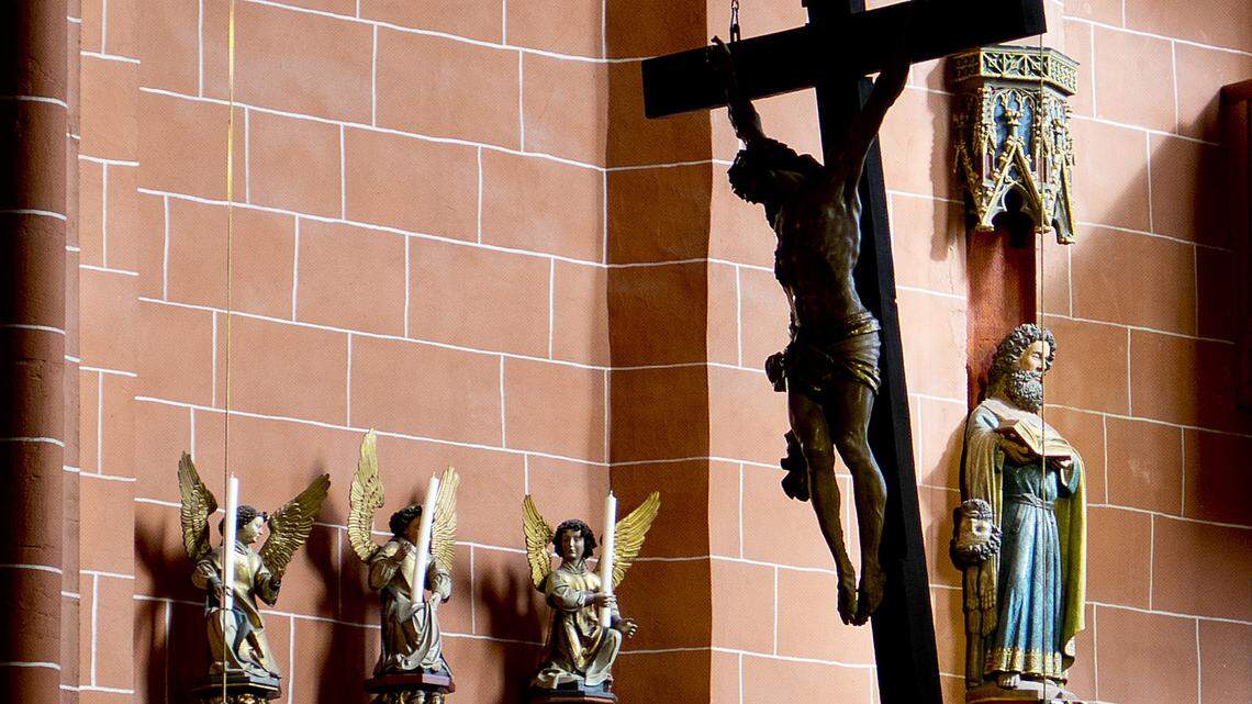 A crucifix is fixed at the ceiling of the Cathedral in Frankfurt, Germany.