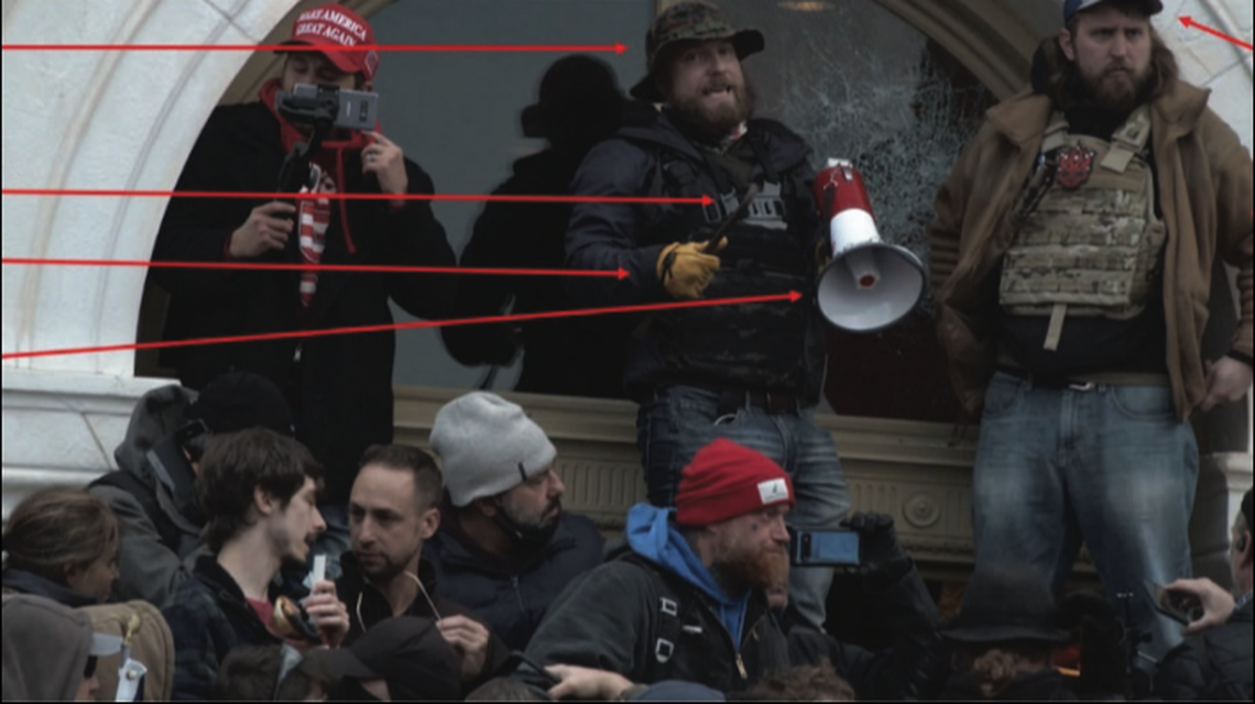 Ryan Nichols, with the bullhorn, and Alex Harkrider to the right, are seen at the U.S. Capitol on Jan. 6, 2020, authorities say. Screengrab from FBI.