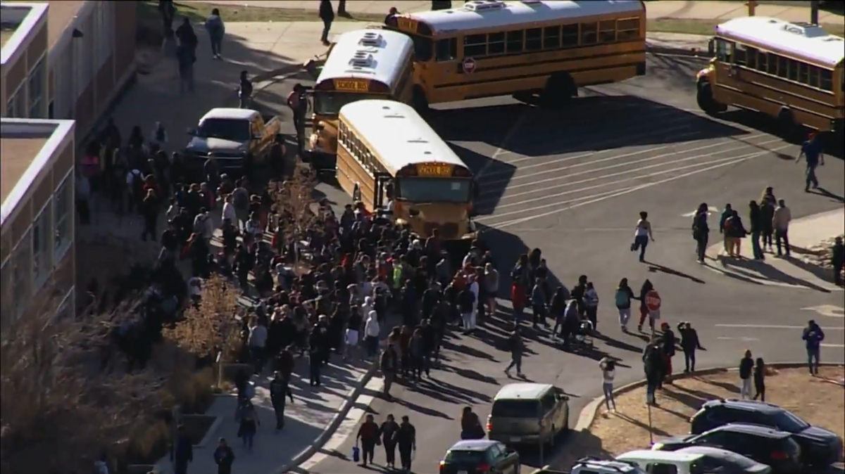 Parents and students gathered outside Hinkley High School in Aurora, Colorado after three students were injured in a shooting in the parking lot.