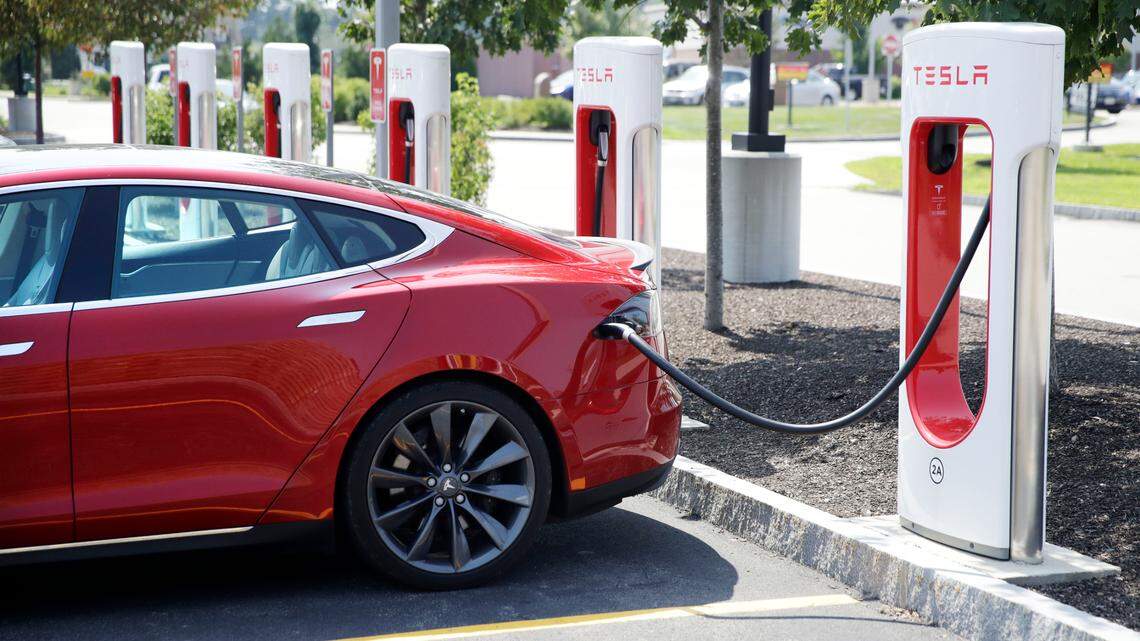 A Tesla Model S is plugged in at a vehicle Supercharging station in Seabrook, New Hampshire, Aug. 24, 2018. A new study finds that many drivers are treating their partially automated cars as self-driving.