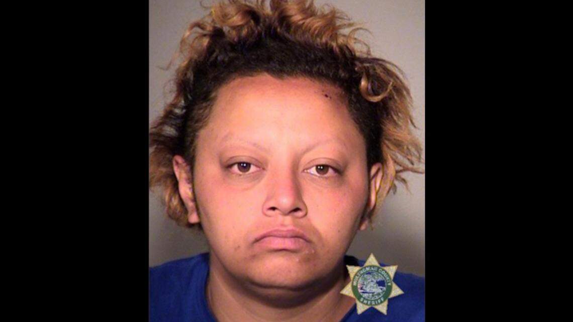 A Portland, Oregon, woman got sentenced to 100 days in prison for lacking a concealed gun license for the firearm she hid in her purse and used to kill a friend threatening to stab her, prosecutors said.
