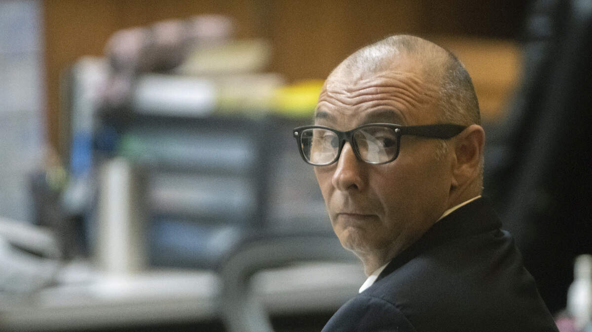 Defendant Gilberto Escamilla looks back before the start of a sentencing hearing Friday, April 20, in Brownsville, Texas. Escamilla entered two pleas of guilty for charges related to the theft of over $1 million of meats he stole and resold over two years through his position with Cameron County.