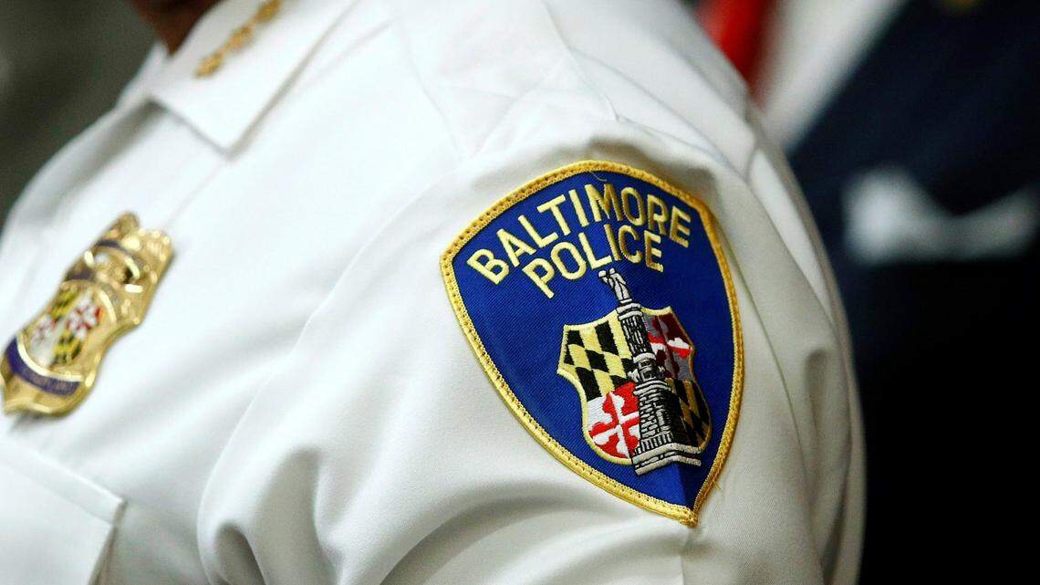 In this Aug. 29, 2018, file photo, a patch depicting the Baltimore Police Department seal is seen. A detective planted a gun and drugs on suspects to justify their arrests while at the Baltimore Police Department, federal authorities say.