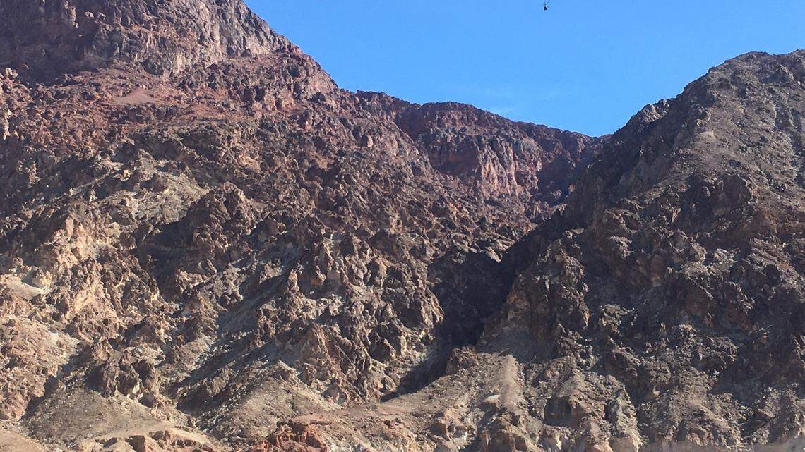 A climber died Saturday after stepping on a rock and triggering a rockslide that swept him past two others 95 feet in Deimos Canyon, Death Valley officials say.