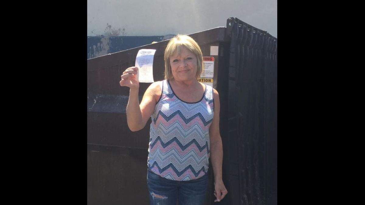 Dena Thompson, manager of The Lucky Spot deli in Portland, Oregon, recruited workers and friends to help her Dumpster dive for the winning lottery ticket.