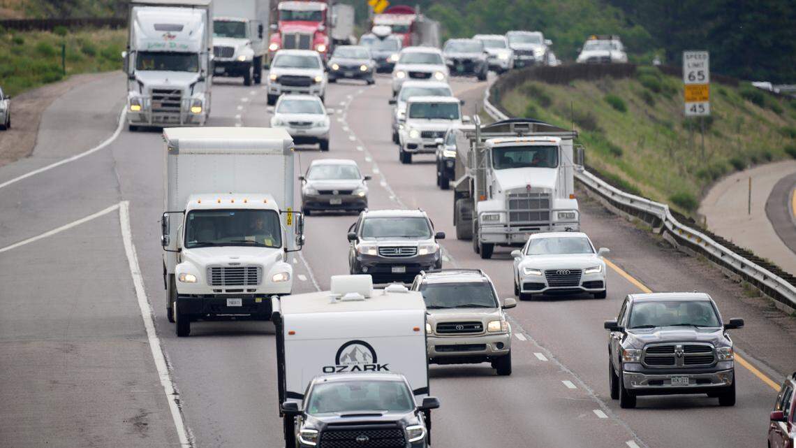 Motorists head west along Interstate 70 to get an early start on the Fourth of July holiday weekend Thursday, July 1, 2021, near Golden, Colo. With COVID restrictions being eased, travelers are expected to be on the roads in spite of gasoline prices topping the $4-mark across the country. (AP Photo/David Zalubowski)