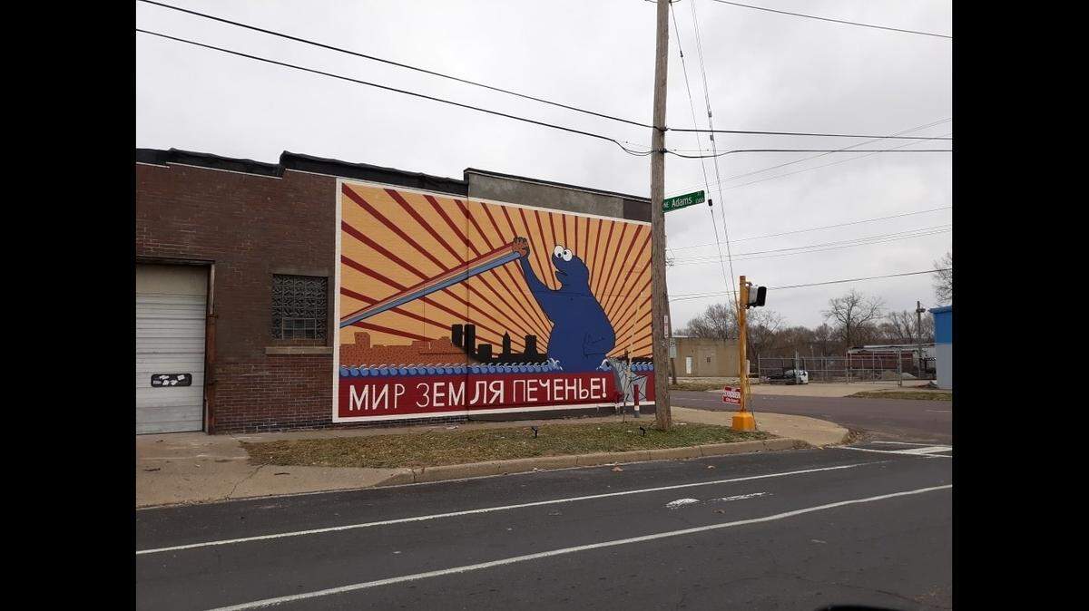 Peoria, Illinois, artist Joshua Hawkins says he was paid by a man to paint a Cookie Monster mural on a building. Photo from Joshua Hawkins