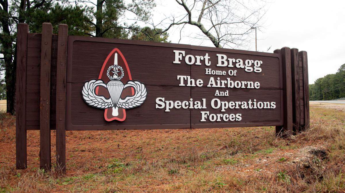 This Jan. 4, 2020 file photo shows a sign for at Fort Bragg, N.C. A Fort Bragg employee received hundreds of thousands of dollars in bribes in exchange for pushing maintenance contracts with the government, prosecutors said. Now, the man is sentenced to 42 months in prison.