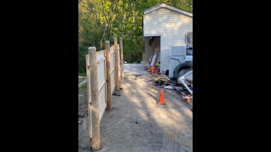 A Maine man sawed off half his neighbor’s garage in a property dispute. The bright colored string seen at the bottom of this photo shows the line he apparently used to guide his cutting.