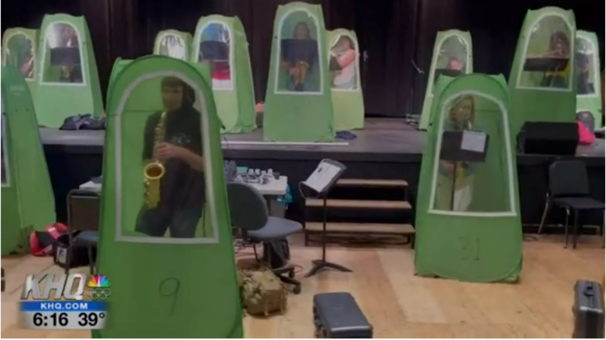 Wenatchee High School band students have played together in socially distanced individual pod tents as Washington schools return to in-person learning.