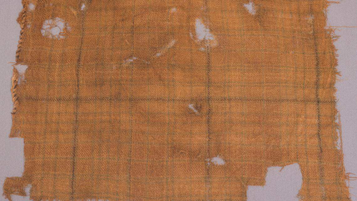 The small piece of fabric may have been dyed in the days of Mary Queen of Scots before landing in a Scottish bog.