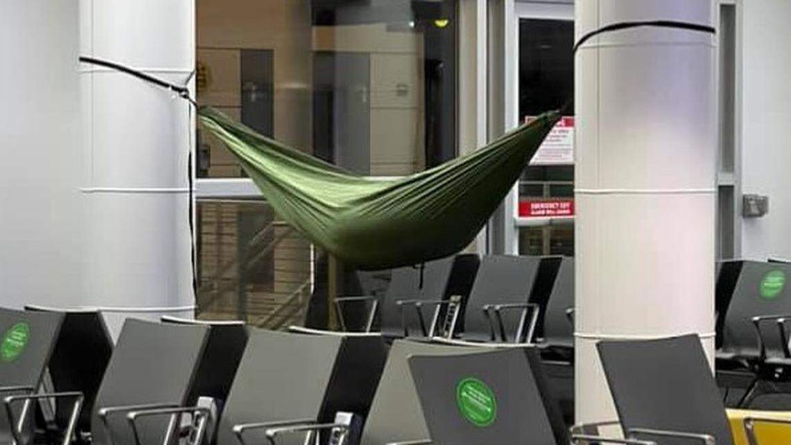 TSA posted a photo of a traveler in a hammock on poles in the Seattle-Tacoma International Airport.
