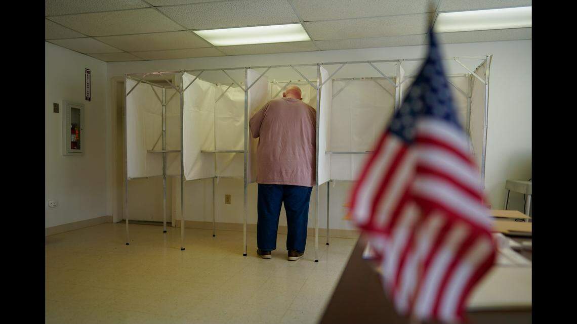 A voter fills out a ballot during the Pennsylvania primary election at the Michaux Manor Living Center in Fayetteville, Pa., May 17, 2022. As the 2022 midterm elections enter their final two-month sprint, a new poll found 48% of voters are more likely to vote for Democratic candidates, while 44% are likely to vote for Republicans.