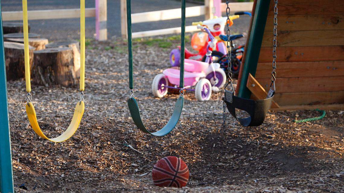 A swing is shown in the front yard of day care Friday, April 9, 2010. A North Carolina man ran an armed trafficking operation in the same house where his wife ran a day care center, authorities said. Now, the man faces decades in prison.
