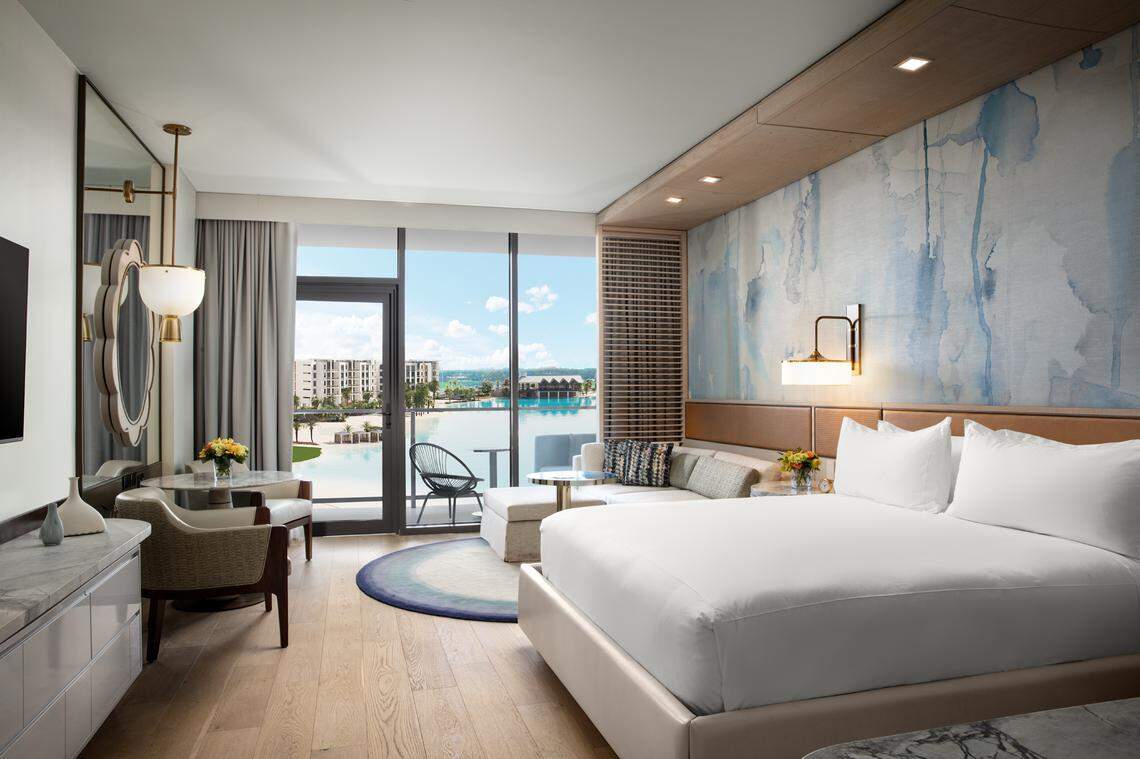 A king guest room at Conrad Orlando with a view of the lagoon outside.