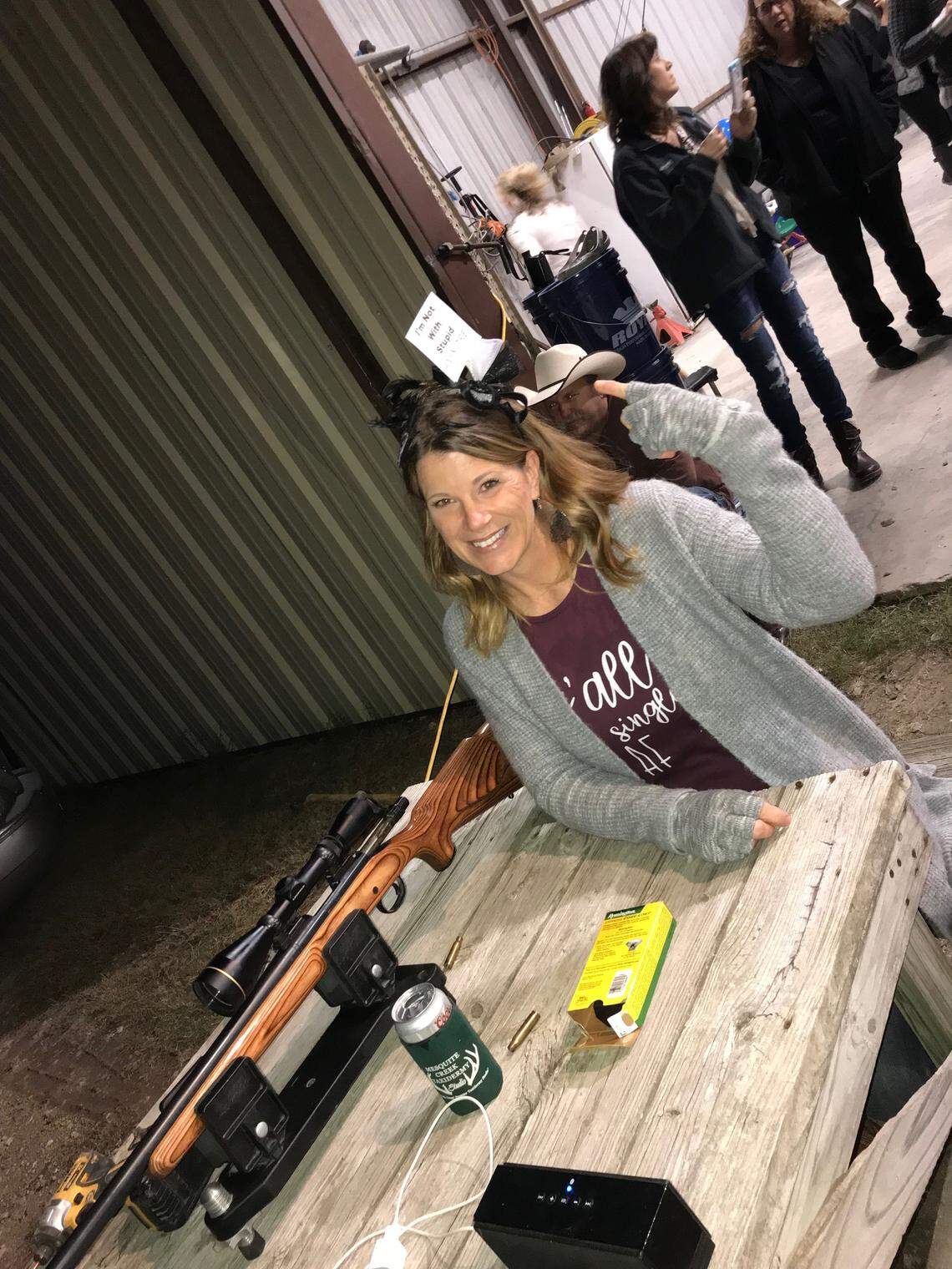 Kimberly Santleben-Stiteler wears her “I’m not with stupid” crown after lighting up her wedding dress from 200 yards away.