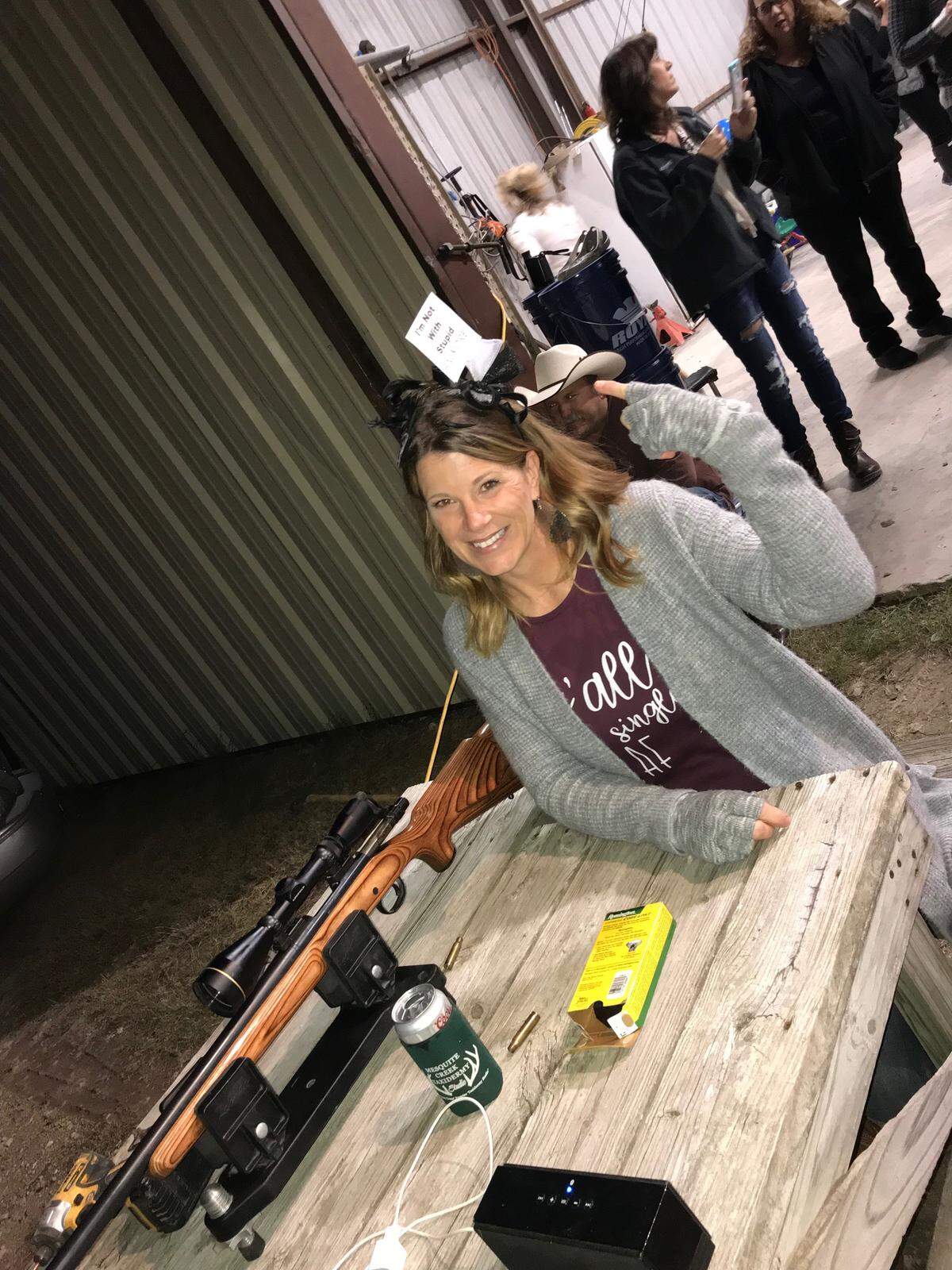 Kimberly Santleben-Stiteler wears her “I’m not with stupid” crown after lighting up her wedding dress from 200 yards away.