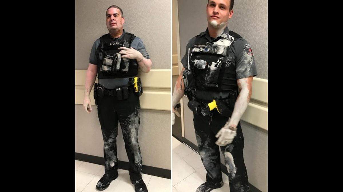 Photos show how paint rubbed off the suspect and onto police as they tried to handcuff him Monday morning.