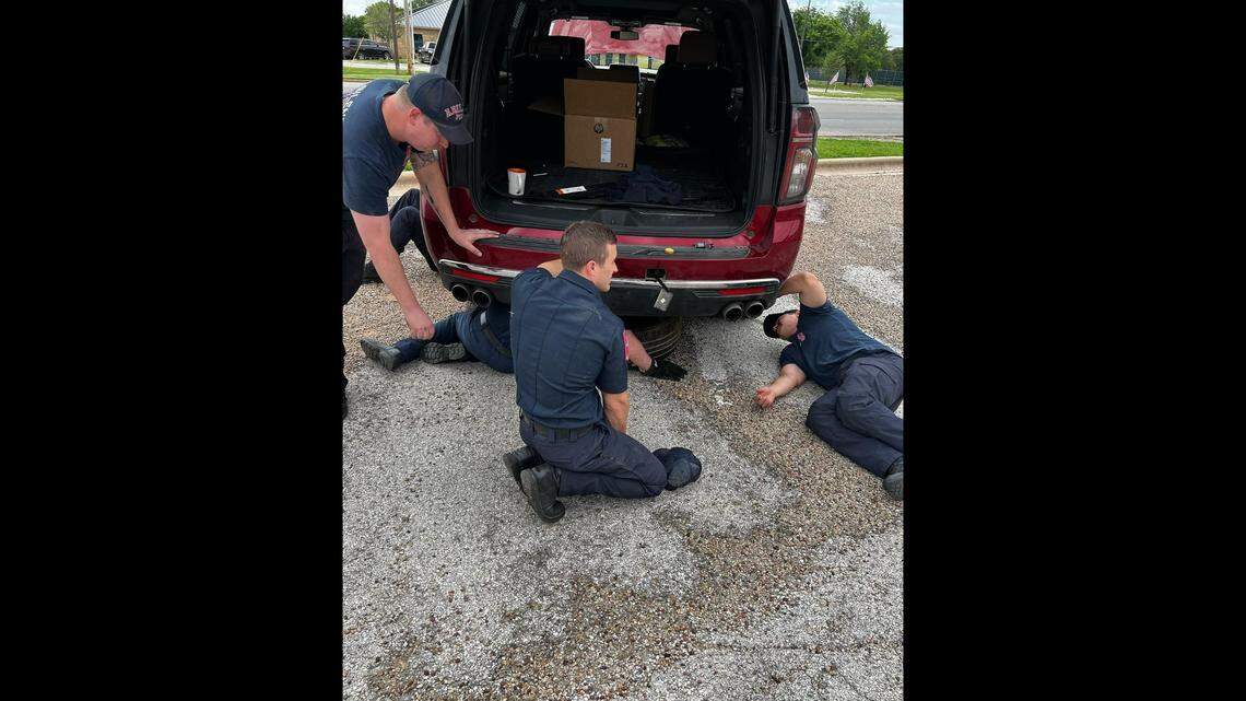 After searching for about 20 minutes, firefighters found and dislodged a kitten stuck under a woman’s SUV, officials said.