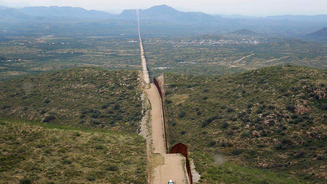 A man was shot to death while attacking a U.S. border patrol agent with a wooden club in New Mexico, officials said.