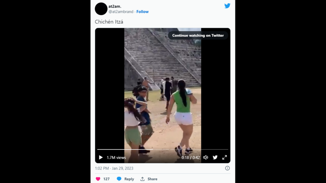 The man was beaten by a fellow tourist after climbing the steps of the temple.