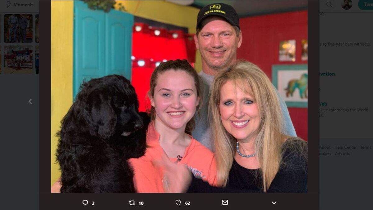Jay and Amy Novacek pose with Hannah Westmoreland of Quinlan, Texas and her future service dog, Joey.