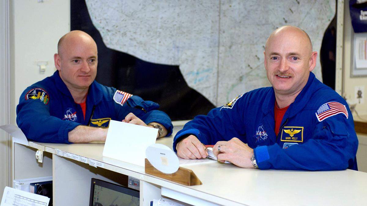Former astronaut Mark Kelly, right, shown with his twin brother Scott Kelly, has no political experience as he takes on Martha McSally for U.S. Senate. That’s not necessarily a negative today.