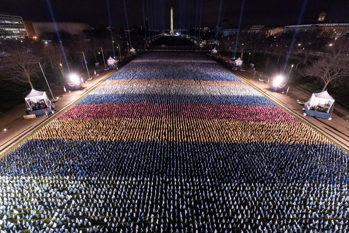 Flags are placed on the National Mall, with the Washington Monument behind them, ahead of the inauguration of President-elect Joe Biden and Vice President-elect Kamala Harris, Monday, Jan. 18, 2021, in Washington. (AP Photo/Alex Brandon)