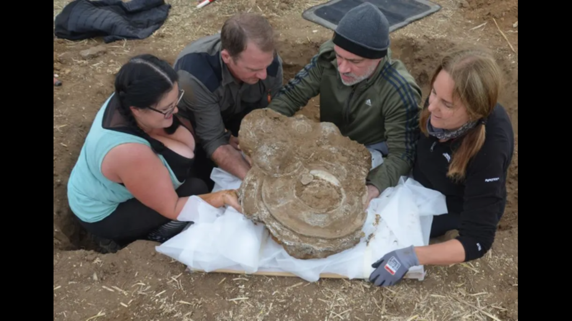 The pieces were stacked together in the pit, likely placed there for safekeeping or as an offering, officials said.