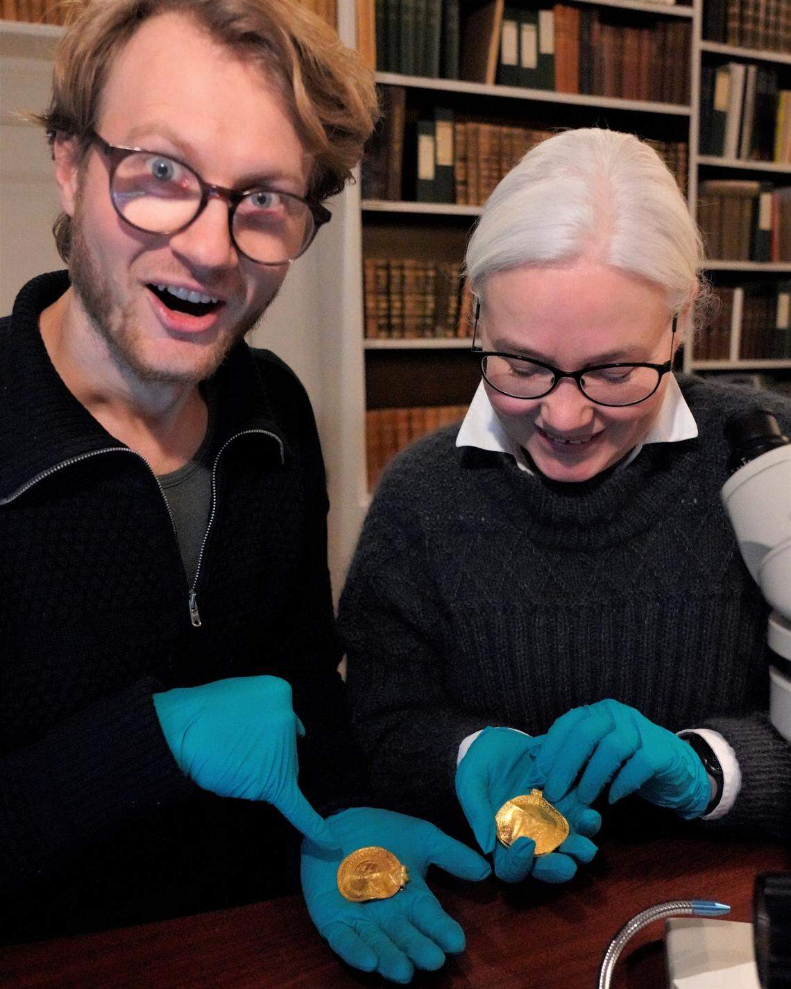 Krister Vasshus, left, and Lisbeth Imer, right, worked together to decipher the coin.