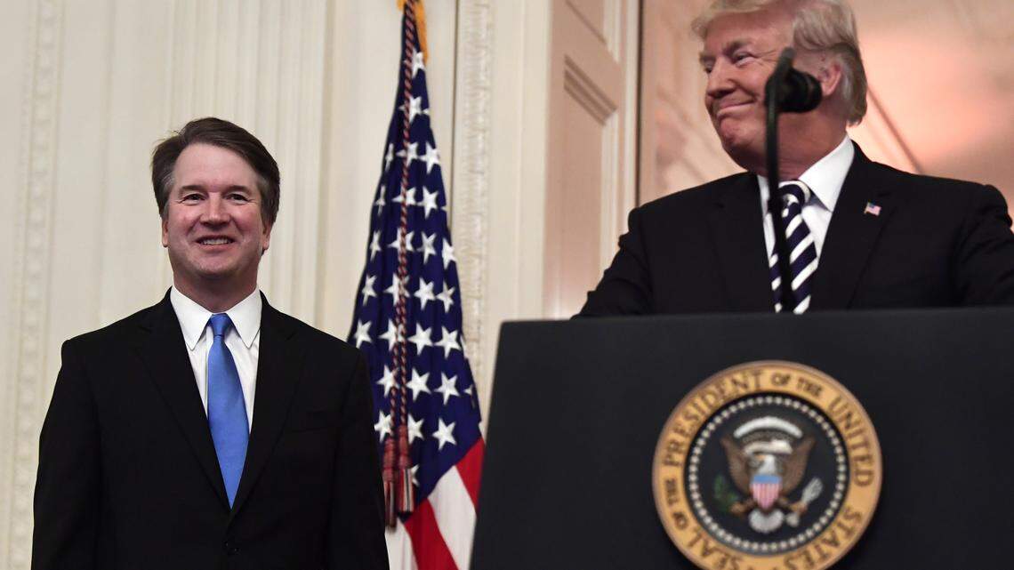 President Donald Trump smiles as he stands with Supreme Court Justice Brett Kavanaugh before a ceremonial swearing in in the East Room of the White House on Monday. Kavanaugh will be the target of a ritual hex at a Brooklyn pagan bookstore on Oct. 20. Trump has been ritually hexed at the same bookstore before.