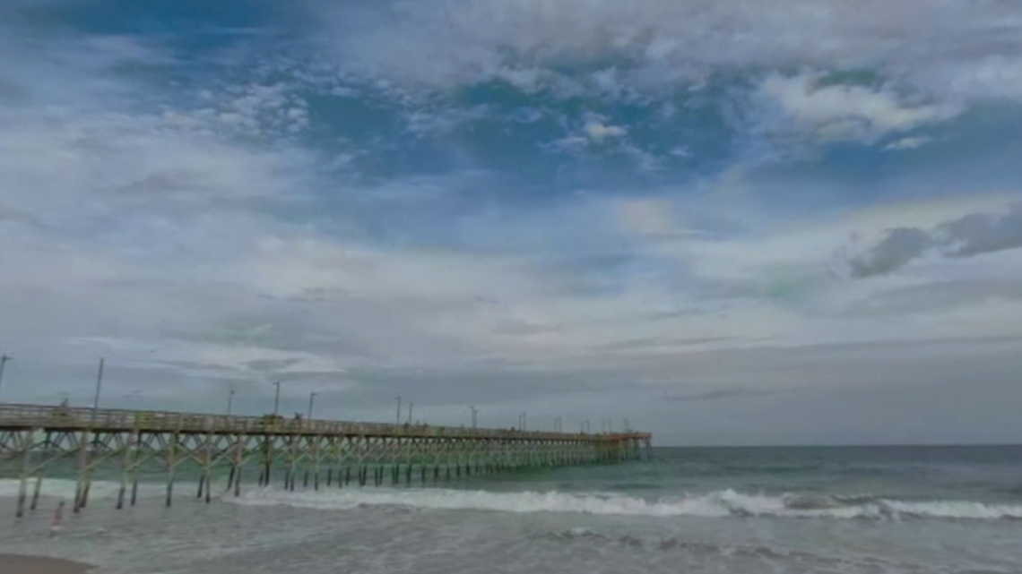 A shark hunting fish near the Surf City pier “grazed” a surfer’s leg with its teeth, North Carolina officials said.