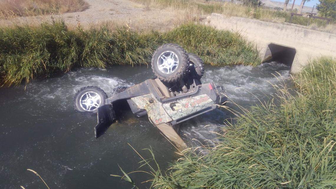 A child was trapped in a UTV with only their nose and mouth above the water after crashing into a canal, Wyoming police said.
