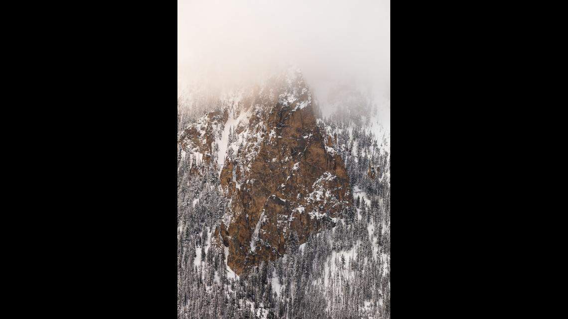 Bunsen Peak through low clouds after a spring snowstorm.