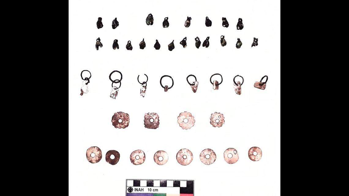 The child was buried alongside numerous grave goods including beads and ceramics.